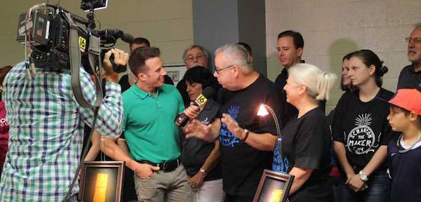 The author and his wife Debi giving a demonstration to a local television station about lasers and holography. 